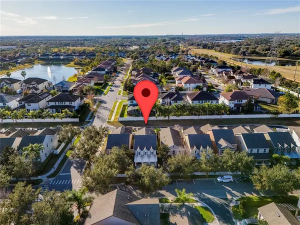 an aerial view of residential houses with outdoor space