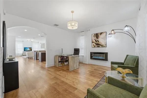 a view of a livingroom with furniture and a window