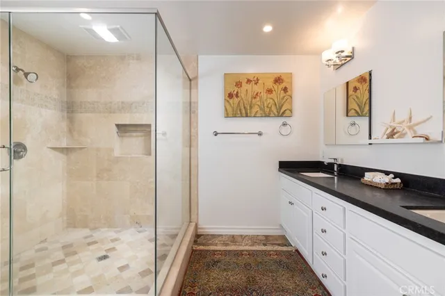 a kitchen with granite countertop a sink and cabinets