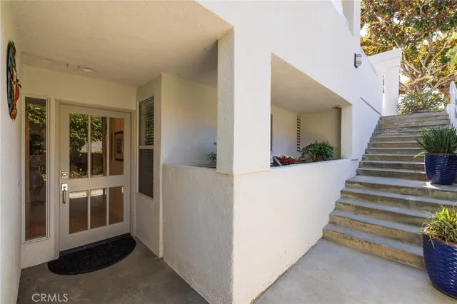 a backyard of a house with outdoor seating