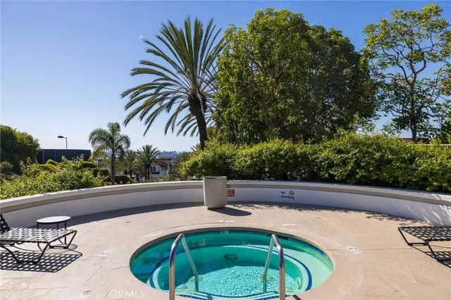 a view of a swimming pool with a table and chairs