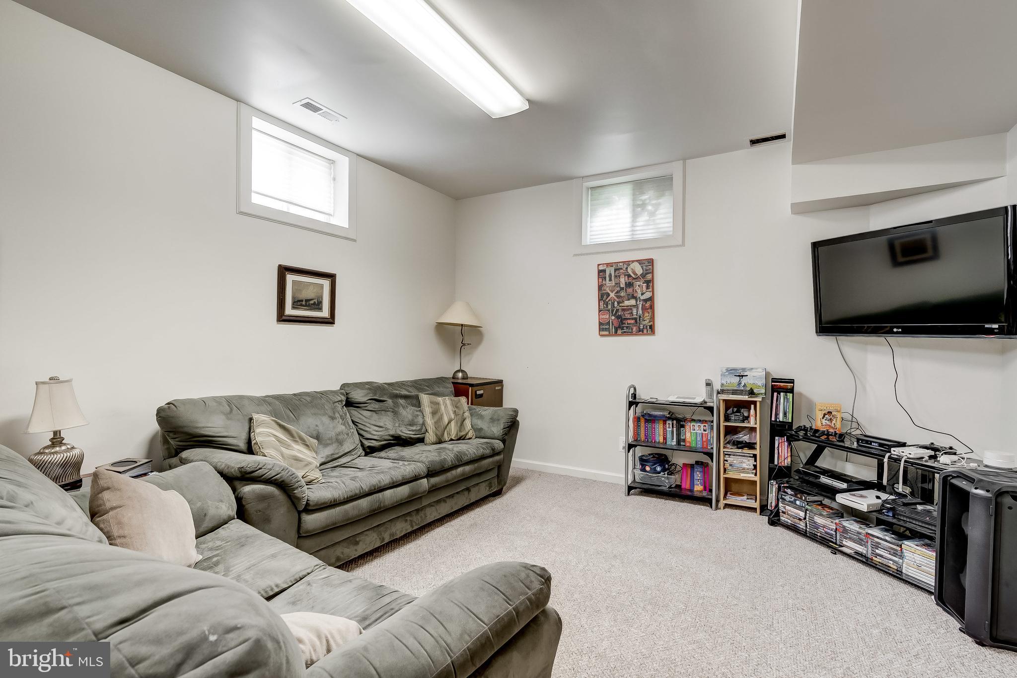 7804 Muncaster Mill Road Gaithersburg, MD 20877 - Photo 26 of 34 Basement Living Area