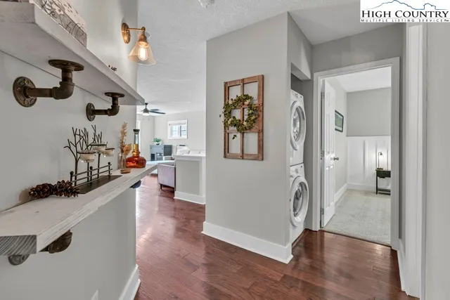 a view of a hallway with washer and dryer