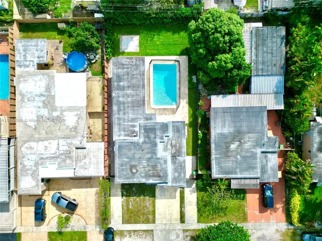 an aerial view of a house with a garden