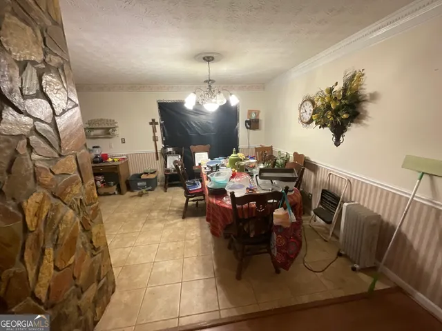 a living room with furniture and a dining room