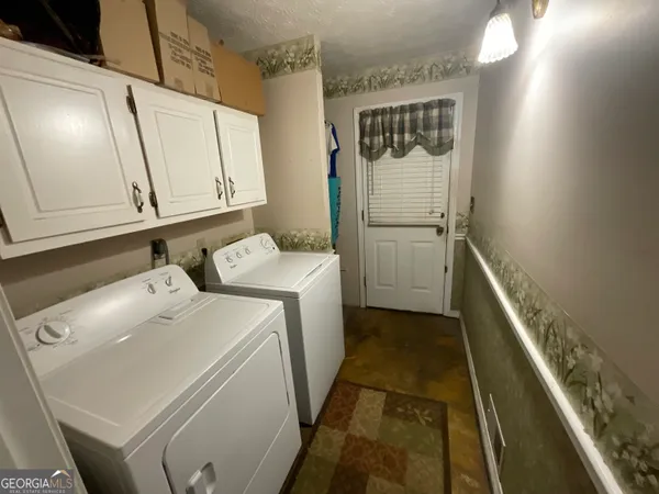 a bedroom with furniture and a chandelier