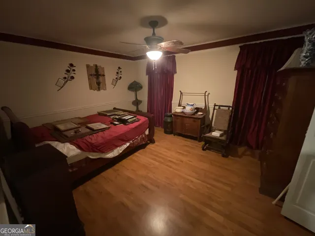 a bedroom with a bed and furniture
