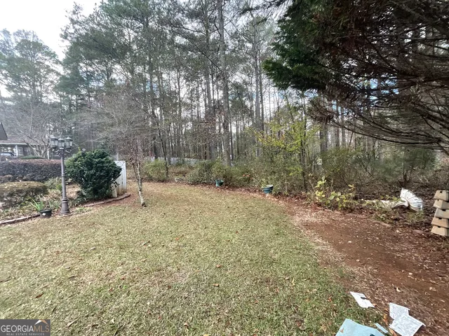 a backyard of a house with lots of green space