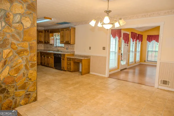 a view of a big room with wooden floor and closet in a room