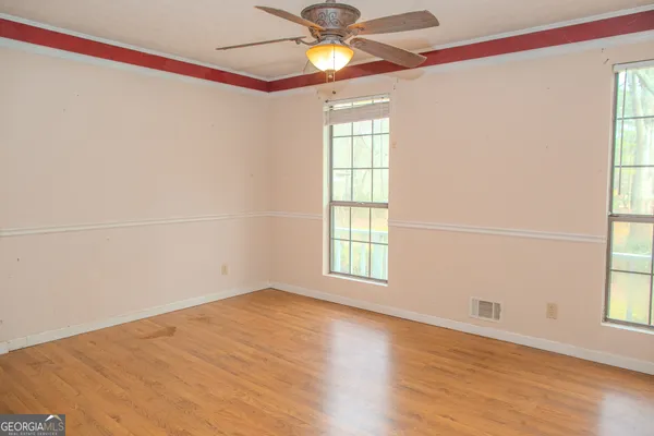 a view of a yard with a tree