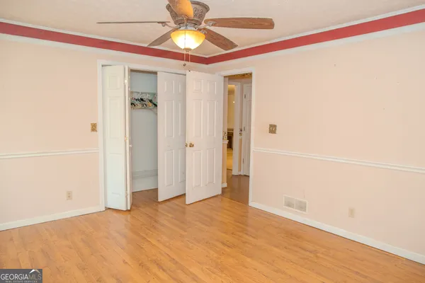 a view of a house with a yard and tree s