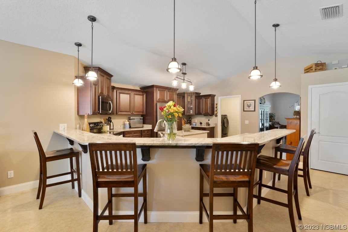 1815 Air Park Road Edgewater, FL 32132 - Photo 13 of 54 a dining room that has a table and chairs in it