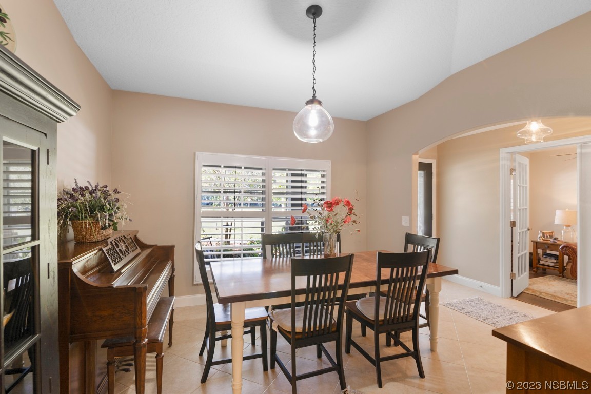 1815 Air Park Road Edgewater, FL 32132 - Photo 14 of 54 a view of a dining room with furniture window and outside view