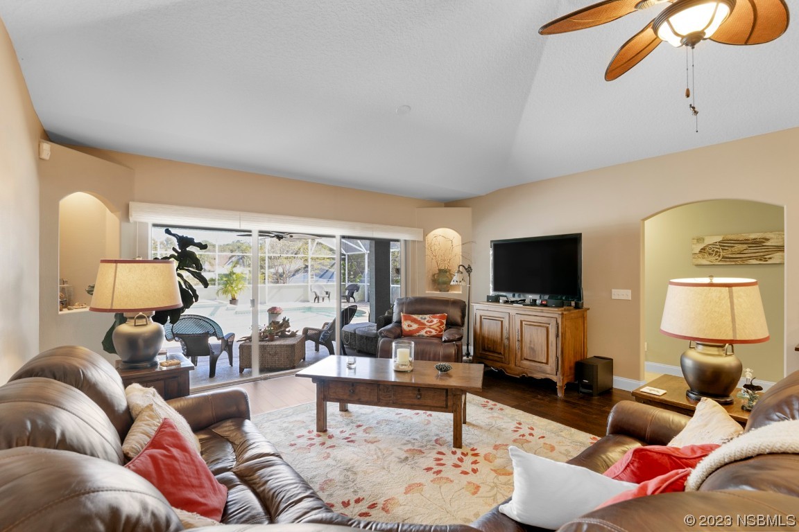 1815 Air Park Road Edgewater, FL 32132 - Photo 17 of 54 a living room with furniture and a flat screen tv