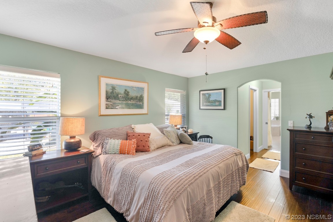 1815 Air Park Road Edgewater, FL 32132 - Photo 21 of 54 a bedroom with a bed and a chandelier