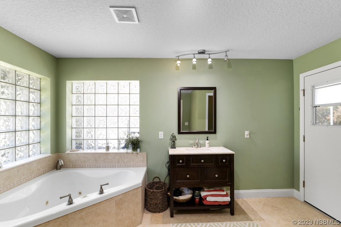 1815 Air Park Road Edgewater, FL 32132 - Photo 22 of 54 a bathroom with a sink and a bathtub