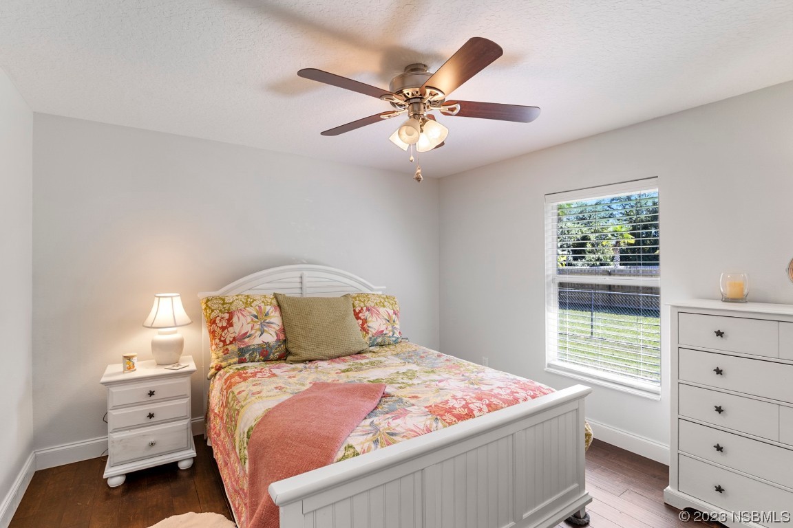 1815 Air Park Road Edgewater, FL 32132 - Photo 24 of 54 a bedroom with a bed and a window