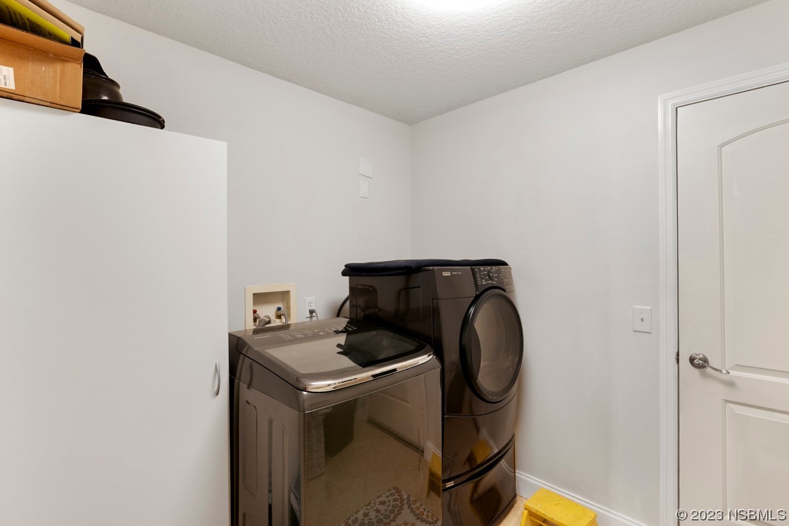 1815 Air Park Road Edgewater, FL 32132 - Photo 29 of 54 a utility room with dryer and washer