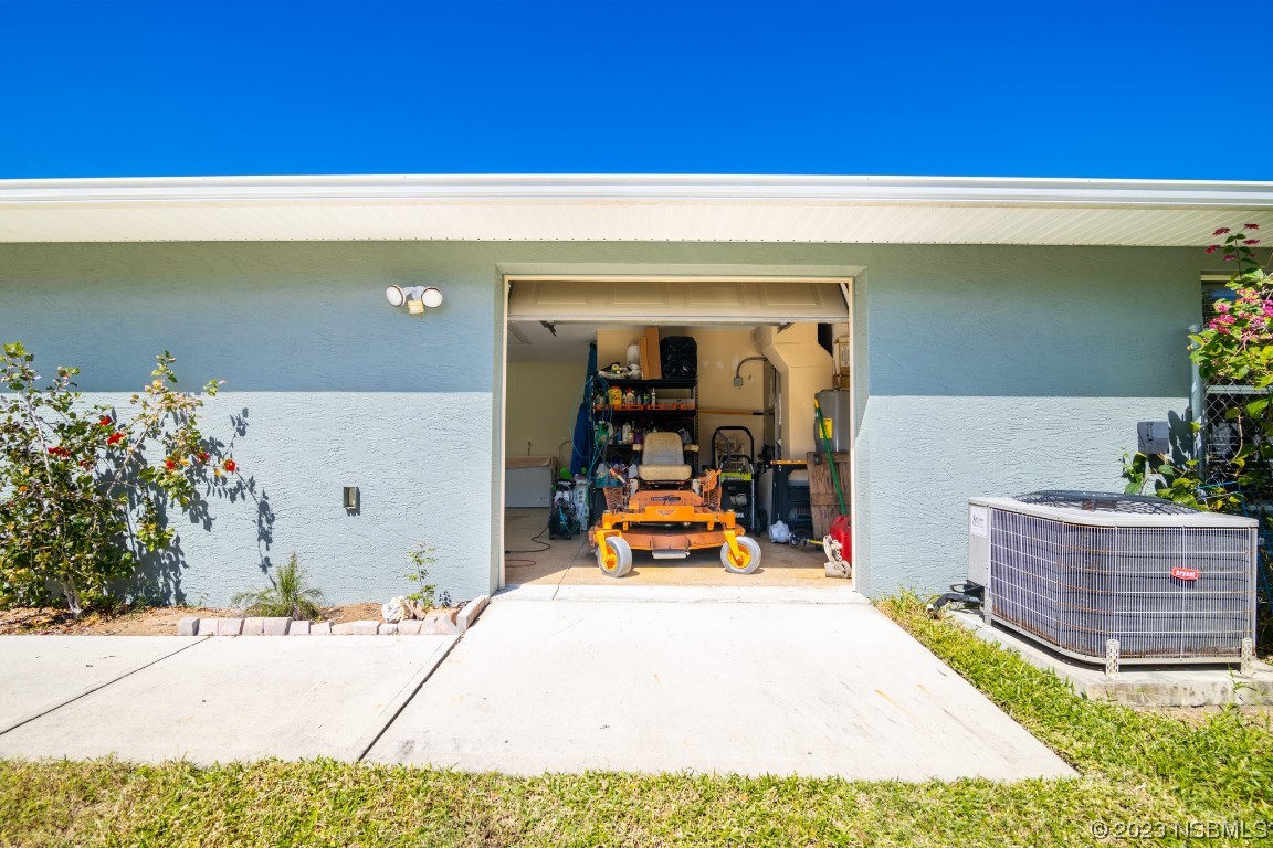 1815 Air Park Road Edgewater, FL 32132 - Photo 31 of 54 a view of a house with backyard and sitting area