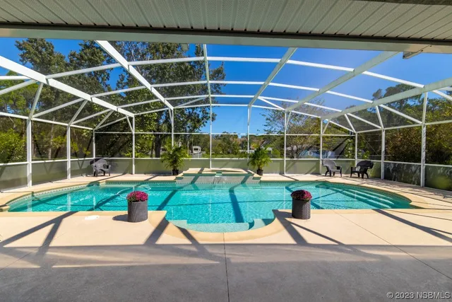 a view of a swimming pool with a patio
