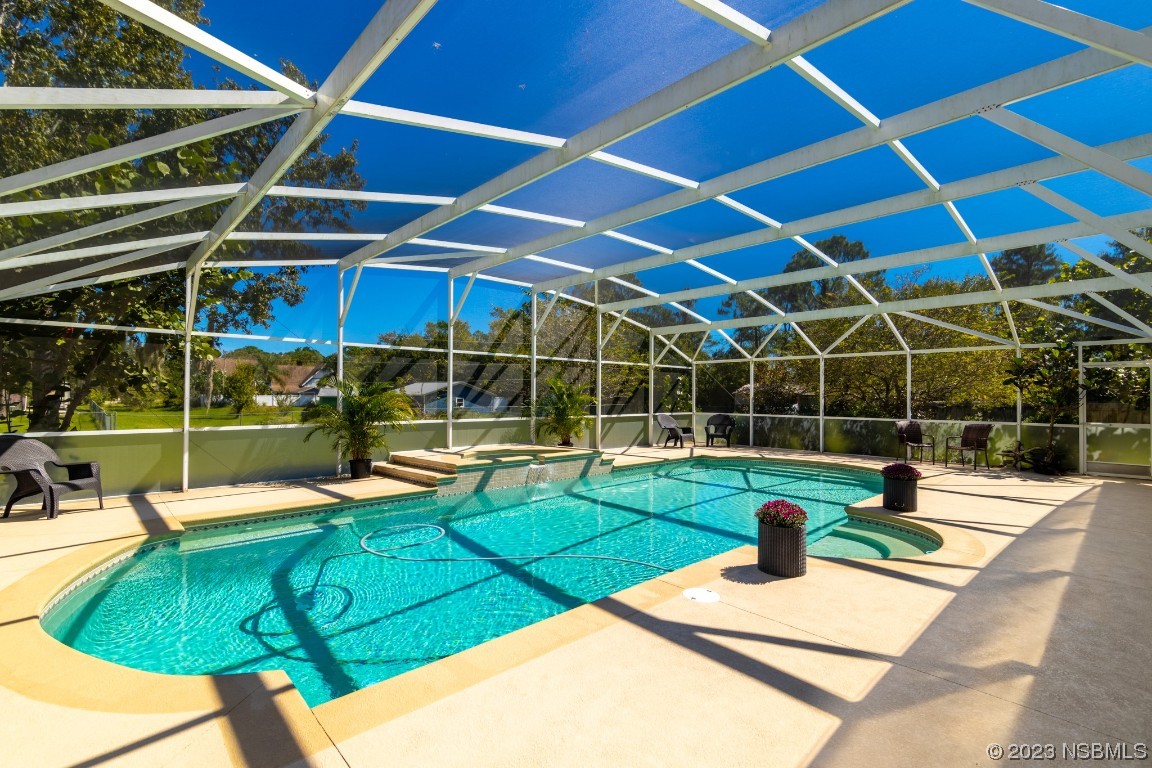 1815 Air Park Road Edgewater, FL 32132 - Photo 34 of 54 a view of a swimming pool with a patio