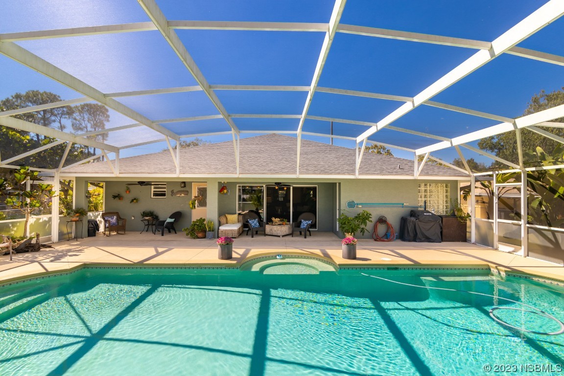 1815 Air Park Road Edgewater, FL 32132 - Photo 36 of 54 a view of a backyard with sitting area