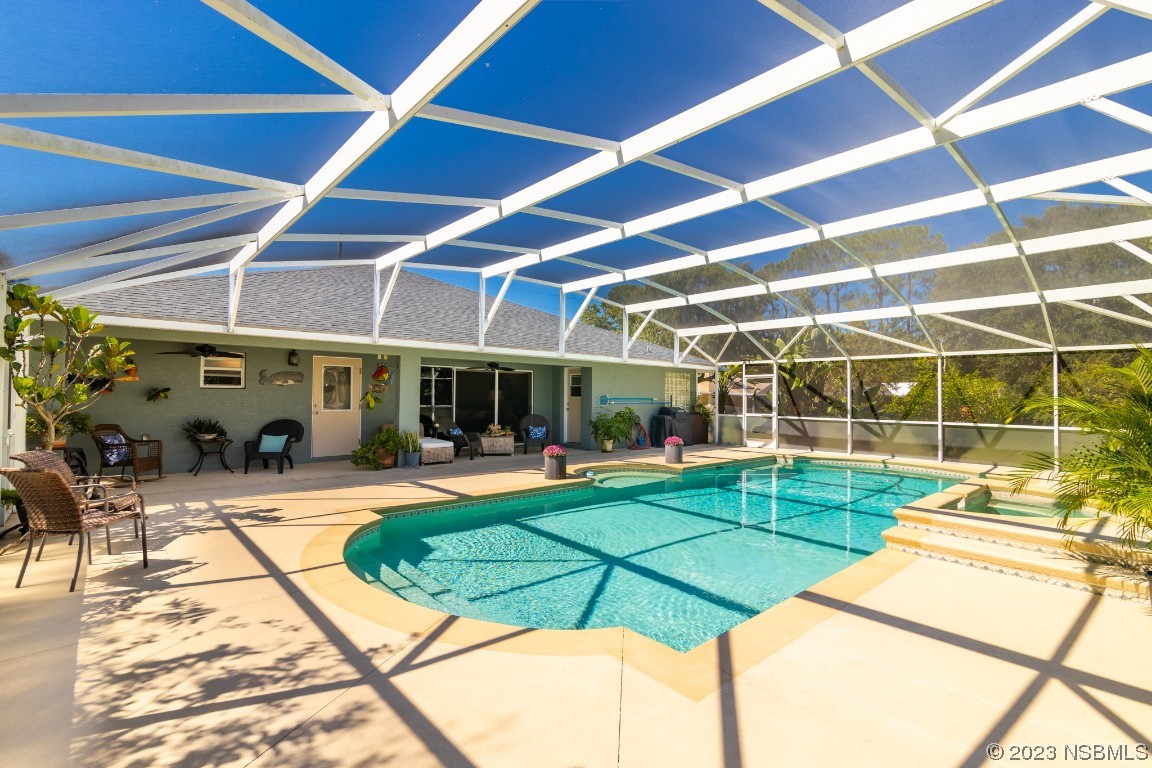 1815 Air Park Road Edgewater, FL 32132 - Photo 38 of 54 a view of a swimming pool with sitting area