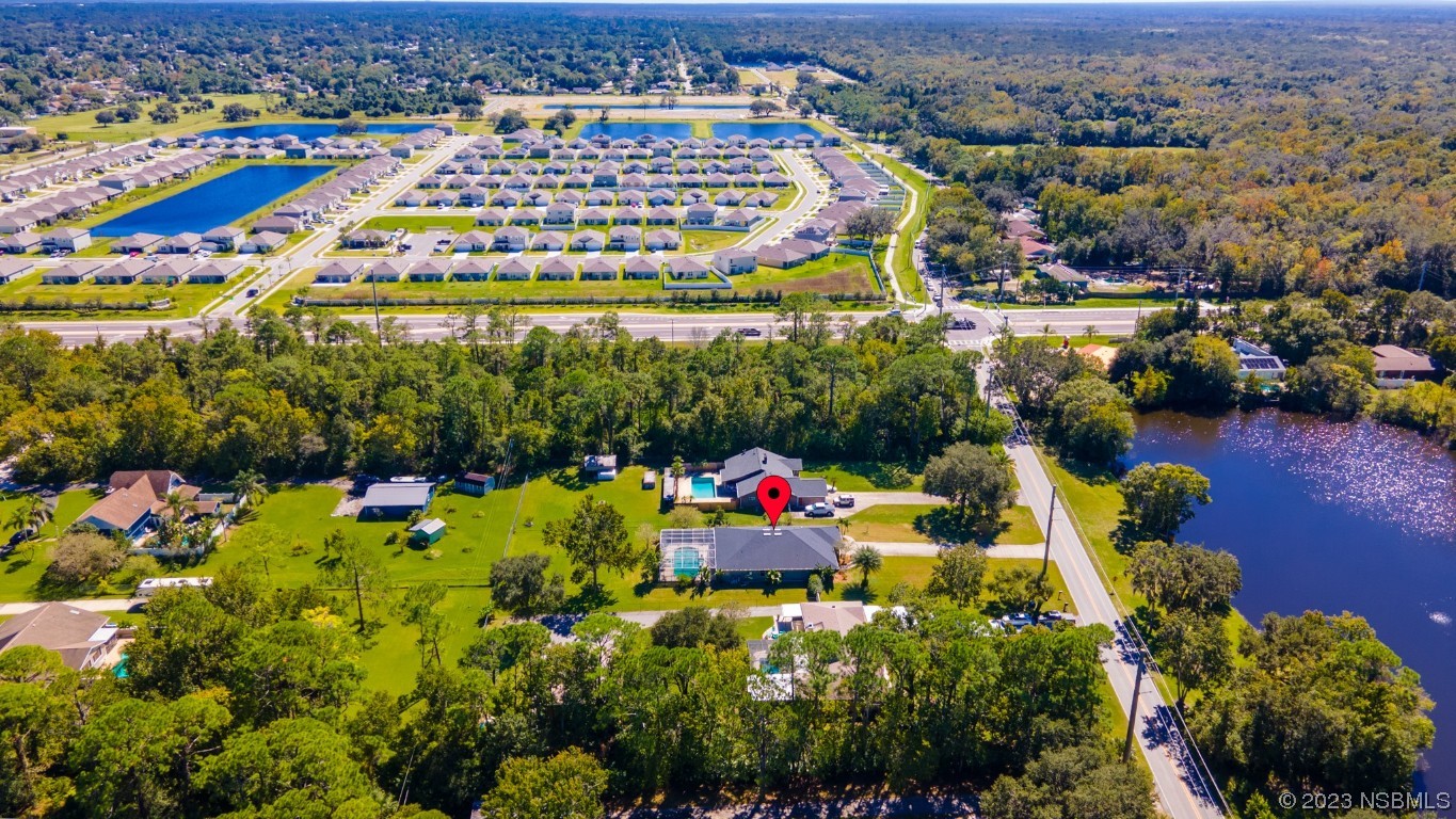 1815 Air Park Road Edgewater, FL 32132 - Photo 46 of 54 an aerial view of a city
