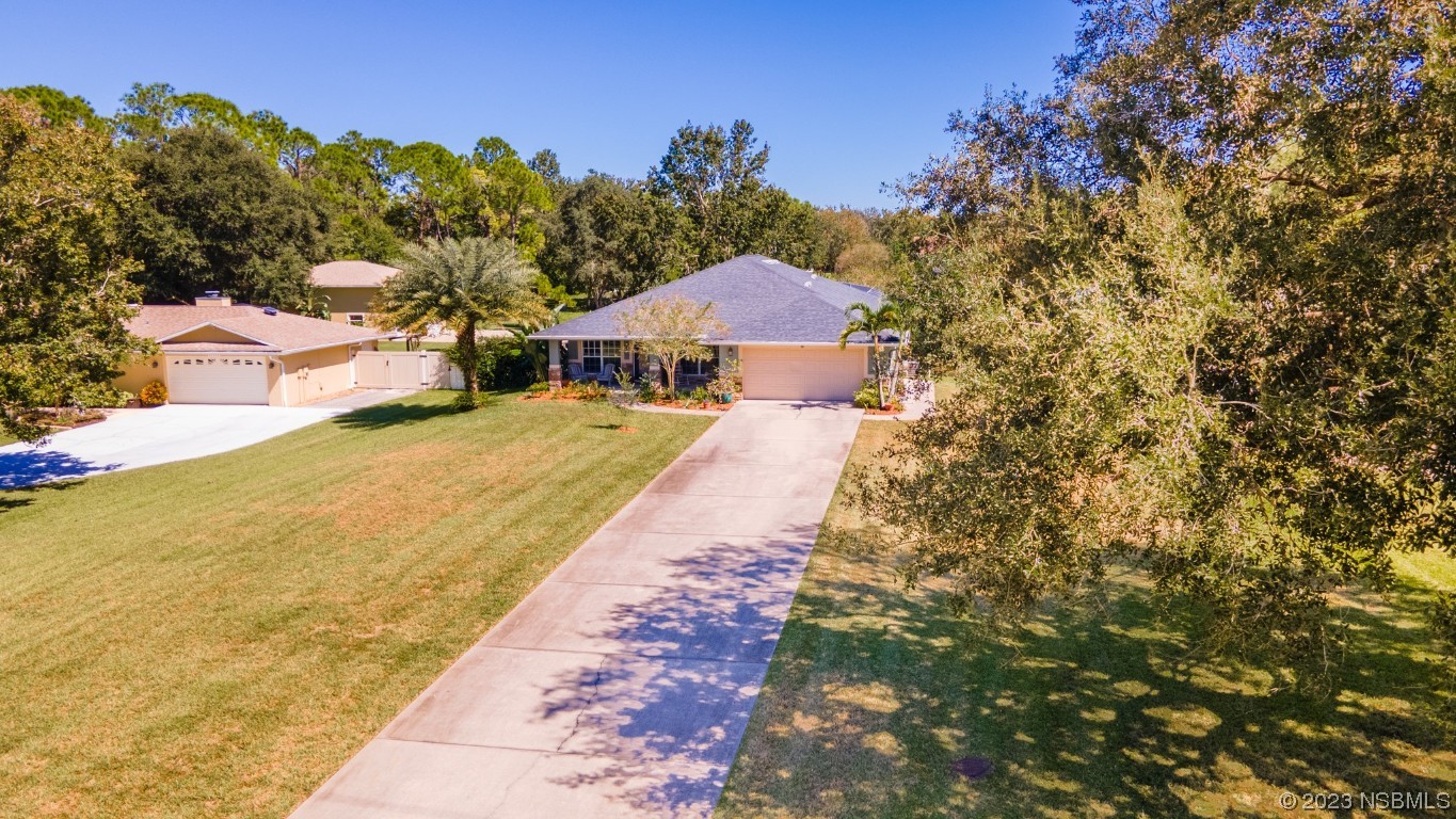 1815 Air Park Road Edgewater, FL 32132 - Photo 50 of 54 a view of a house with a yard