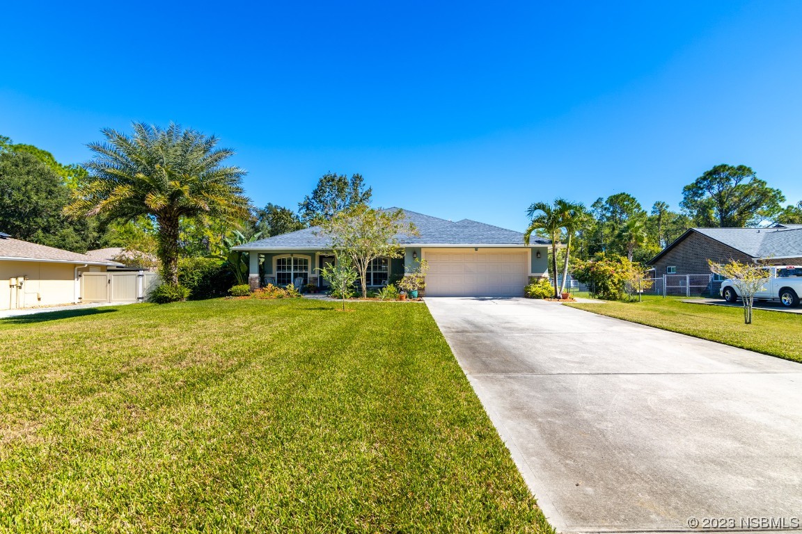 1815 Air Park Road Edgewater, FL 32132 - Photo 53 of 54 a front view of a house with a yard