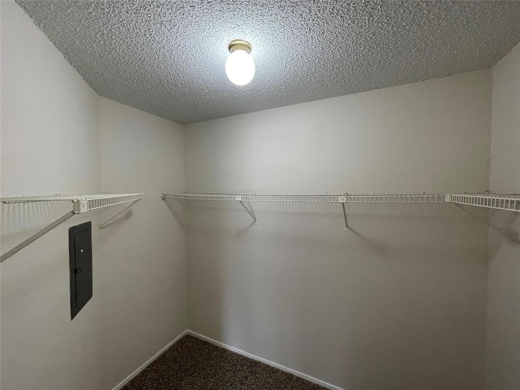 11480 Audelia Road, Unit 231 Dallas, TX 75243 - Photo 11 of 15 a view of a room with racks on the wall