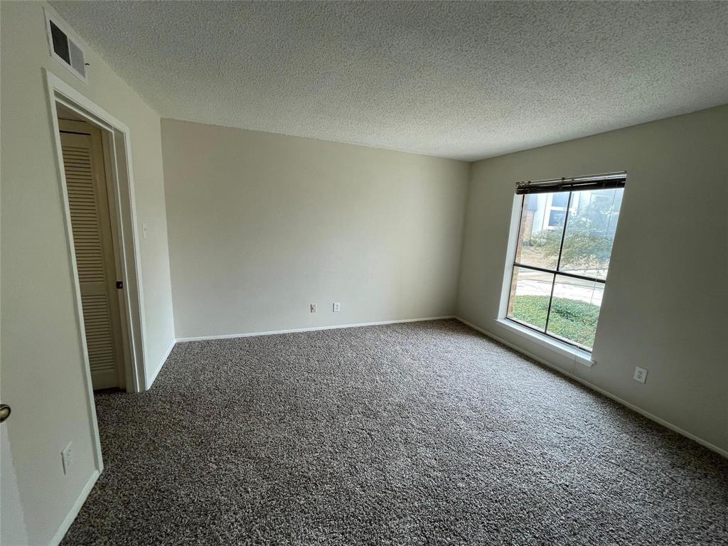 11480 Audelia Road, Unit 231 Dallas, TX 75243 - Photo 3 of 15 an empty room with windows