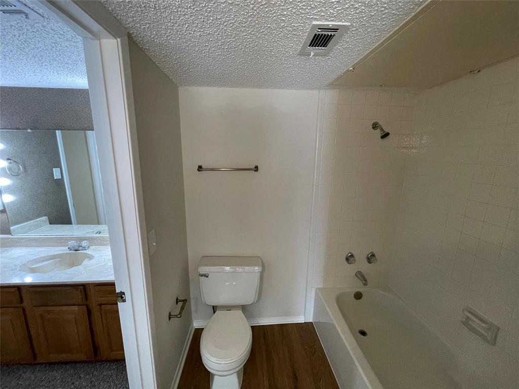 11480 Audelia Road, Unit 231 Dallas, TX 75243 - Photo 7 of 15 a bathroom with a sink and a mirror