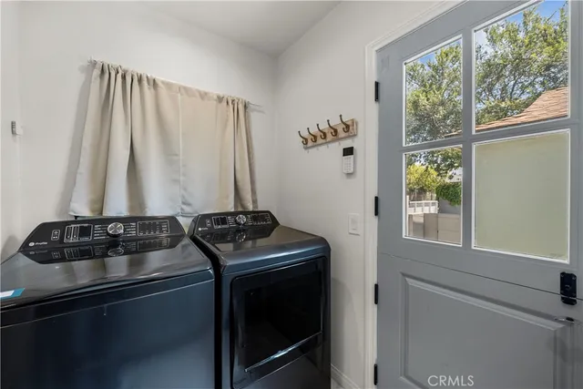 a white toilet sitting next to a bathroom sink and tub