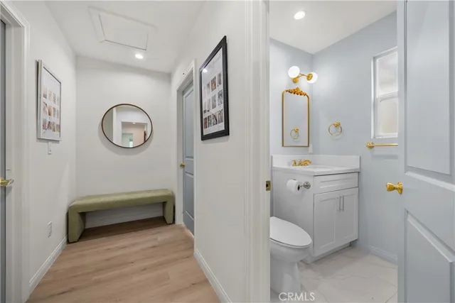 a living room with furniture and a book shelf