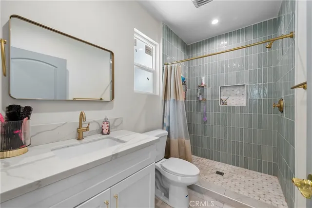 a kitchen with a stove top oven sink and cabinets