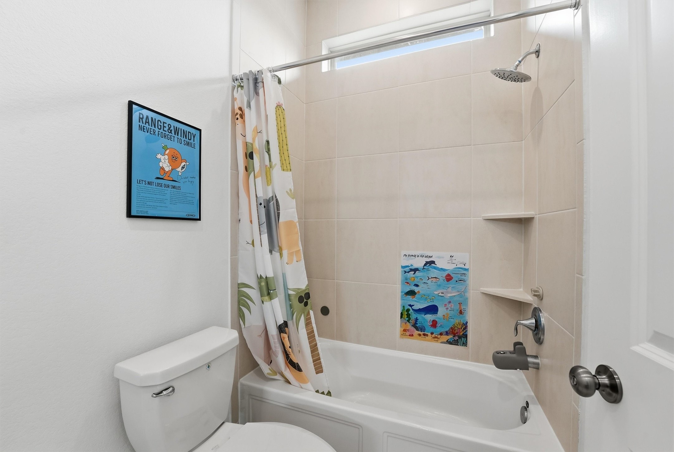 6071 Windward Falls Way Porter, TX 77365 - Photo 7 of 33 This bathroom features a clean, modern design with a tiled shower and tub combo. The space is well-lit with a small window above the shower.