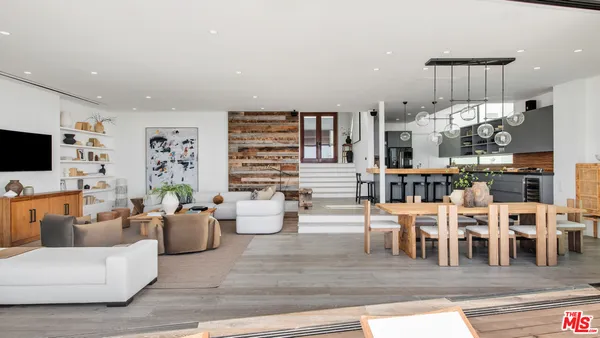 a living room with lots of furniture and a flat screen tv