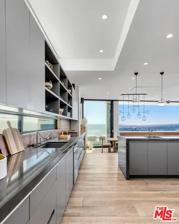 a kitchen with stainless steel appliances granite countertop a sink and cabinets