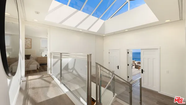 a bathroom with a tub and a glass door shower
