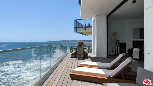 a hallway with a view of living room