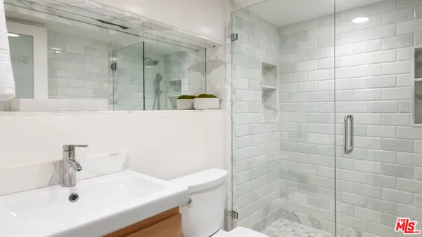 a bathroom with a sink and a shower