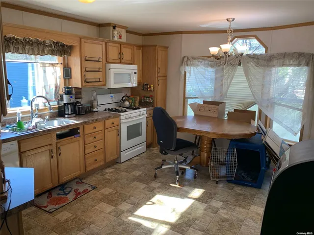 a kitchen with sink cabinets and window