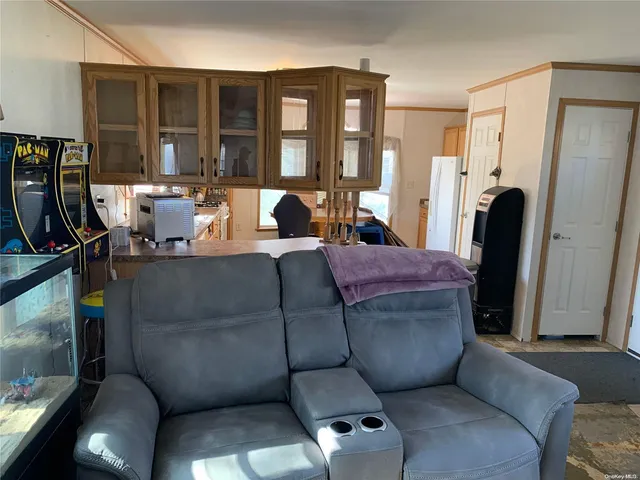 a living room with furniture rug and a large window