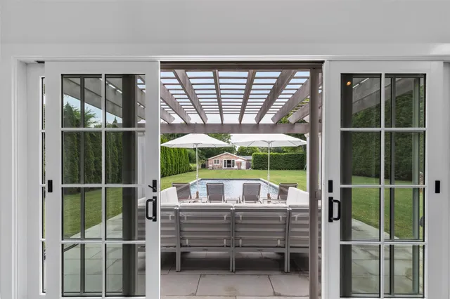 a living room with large windows