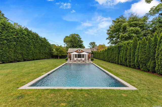 a view of a field with an ocean view