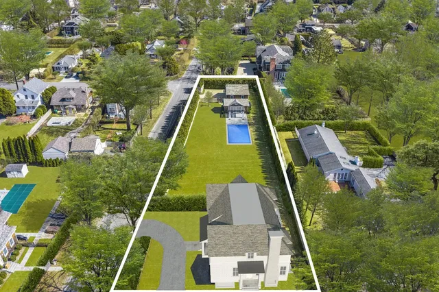 swimming pool view with a garden