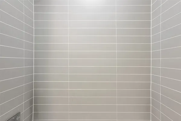 a white toilet sitting next to a white sink