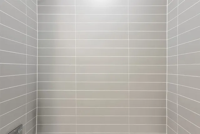 a white toilet sitting next to a white sink