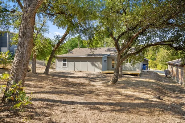 a view of a backyard of a house